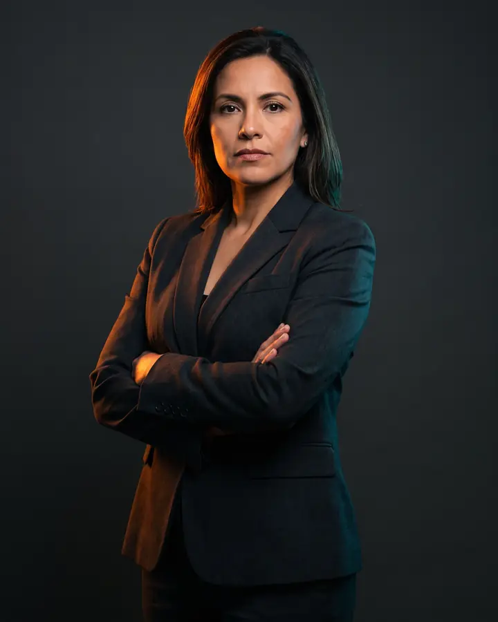 Marisol Rivera, founding partner, photographed against a charcoal backdrop
